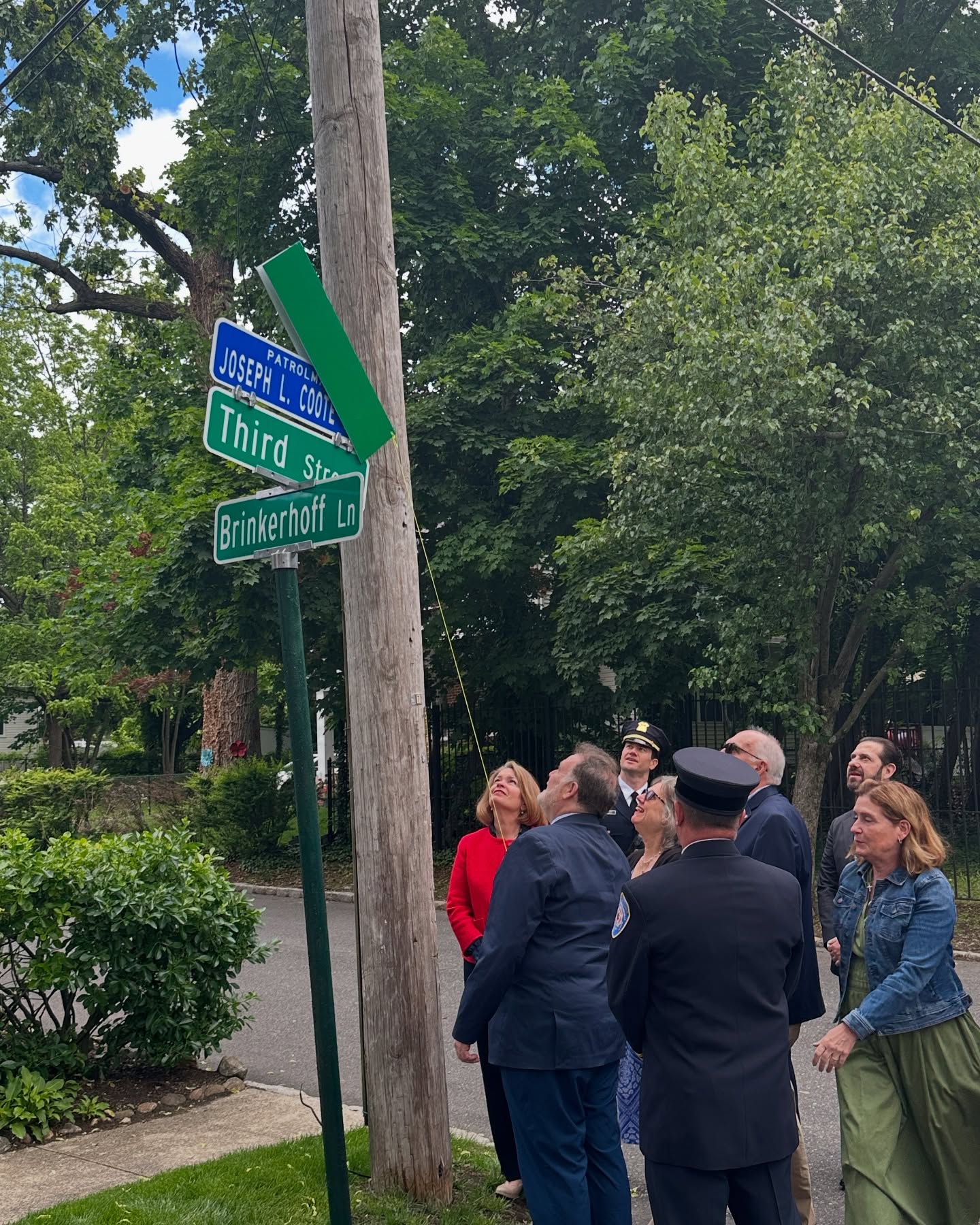 The new name of Third Street in Manhasset is unveiled as Patrolman Joseph L. Coote Way.