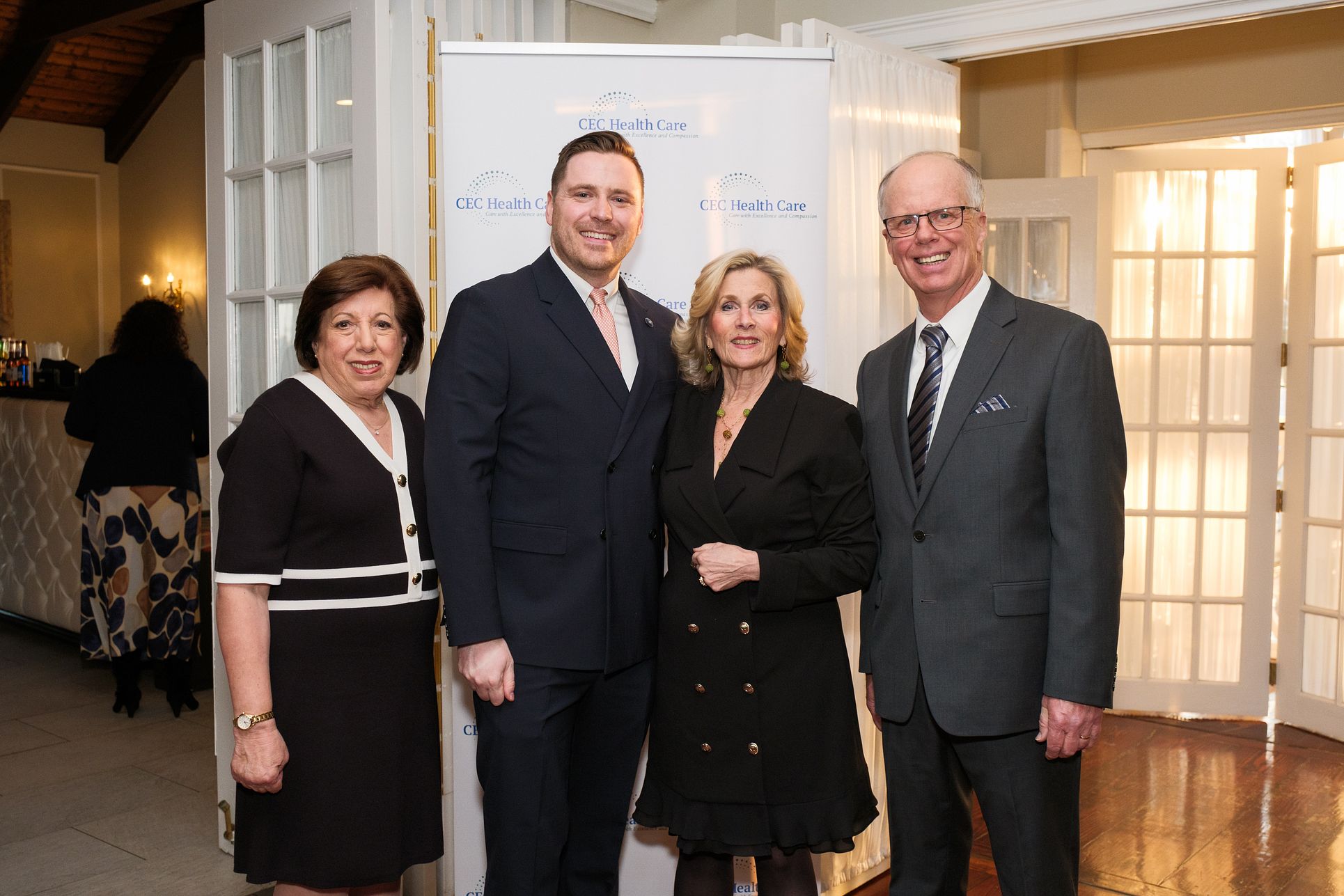 CEC Health Care, including Anne Emmerson, left, and Executive Director Dr. James Dolan, right, honored Glen Cove Mayor Pamela Panzenbeck, center right, and Spectrum Designs CEO Patrick Bardsley, center left, at the 10th anniversary celebration.