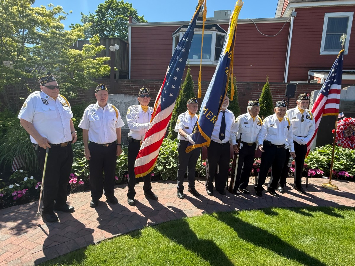 Veterans holding the American Flag during the Village of Farmingdale's Memorial Day parade