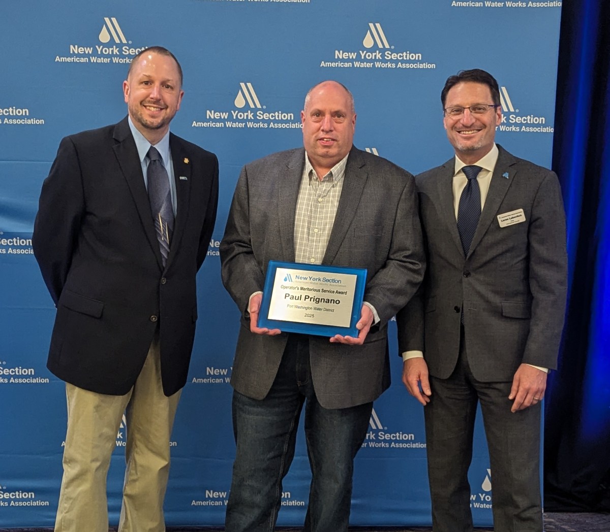 Port Washington Water District Commissioner Paul Prignano (C.) was awarded with the Operator Meritorious Service Award by the New York State Section American Water Works Association.