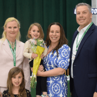Superintendent Kristen Turnow, sixth-grade teacher Ann Monsees with her children and middle school principal Michael Cestaro (L. to R.).