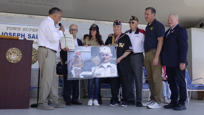 Town of Oyster Bay Supervisor Joseph Saladino honored Joe Varrone, a longtime Memorial Day parade committee member and Vietnam War veteran.