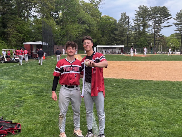 Jayden Gaghan (L.) and Taylor Nitsch (R.) after the team's first perfect game in school history