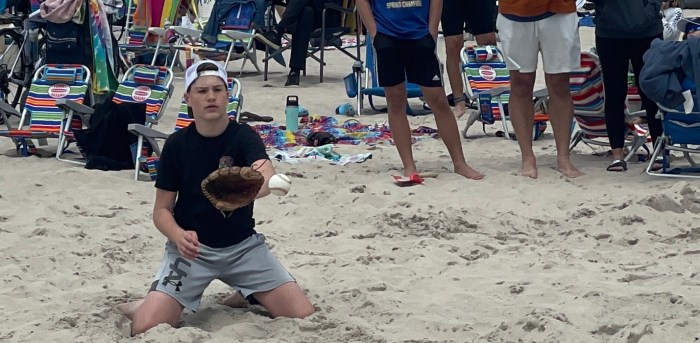 Kids played baseball at the beach 