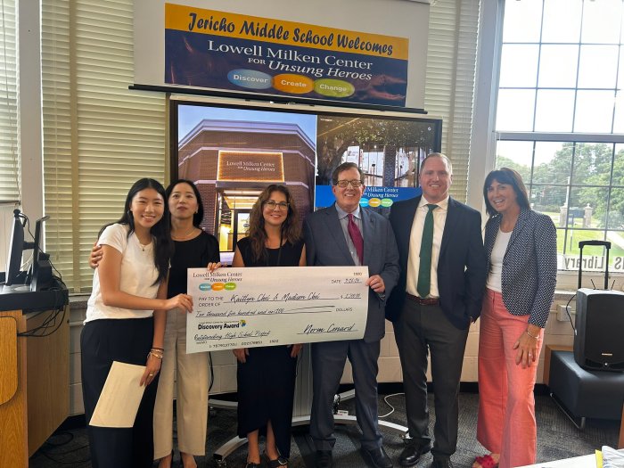 Theresa Cantwell (Far R.) with Jericho students, who are accepting their prize from the Lowell Milken Center.