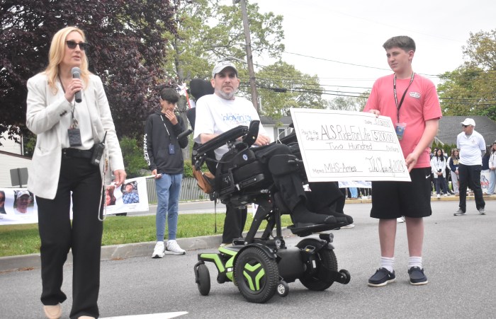 Ames principal Tania Willman addressed students as the school donated $200 to ALS Ride For Life champion Jordan