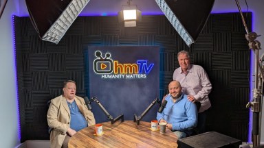 HmTv Founder and Executive Producer Bernie Furshpan (Standing R.) in the center's state-of-the-art podcast studio