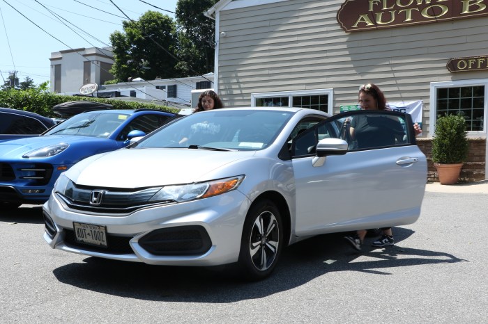 Romero and her daughter stepping into their refurbished 2015 Honda Civic.