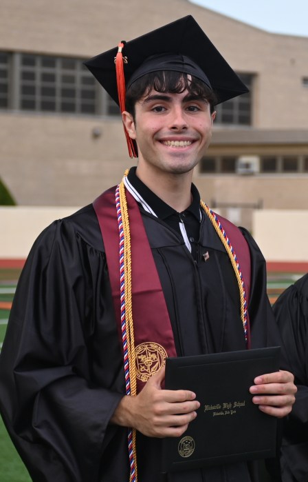 Seniors received their diplomas as they were celebrated on the football field.