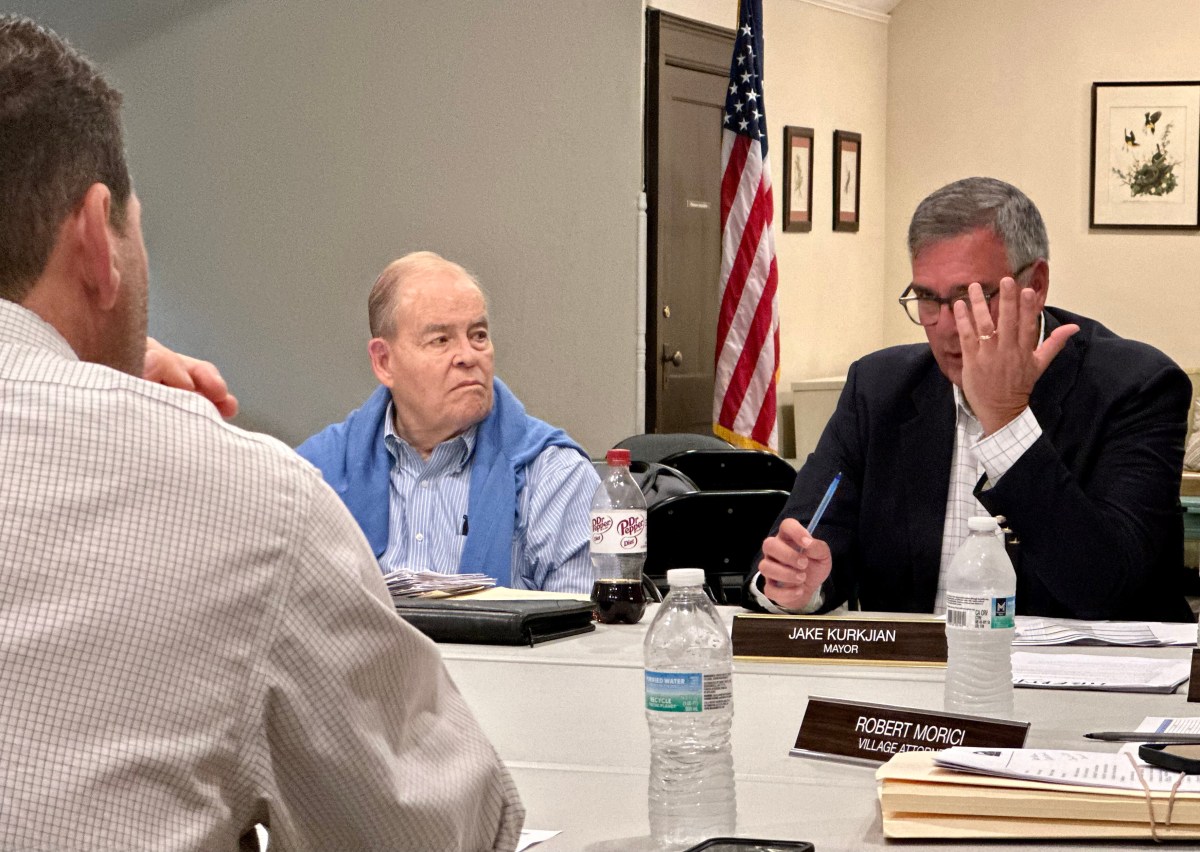 Plandome Mayor Jake Kurkjian discusses the Plandome Fire Department's capital plan with department chiefs.
