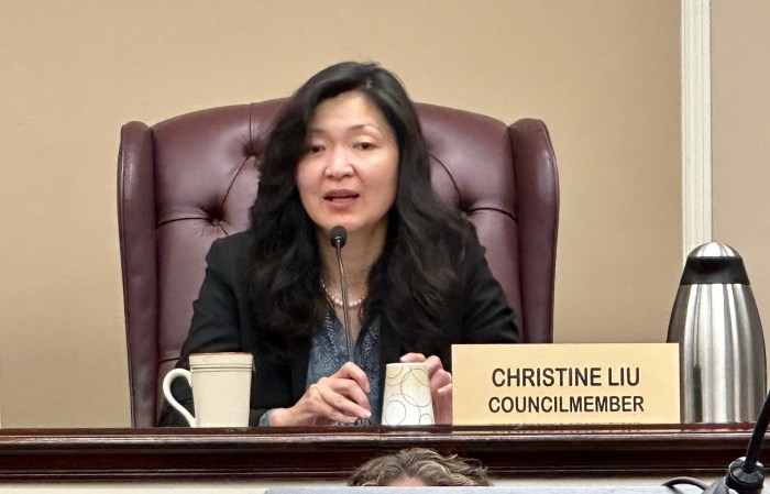 North Hempstead Council Member Christine Liu speaks to residents about the pigeon issue in New Hyde Park.