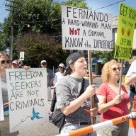 Port Washington ralliers hold up signs in support of Fernando Mejia