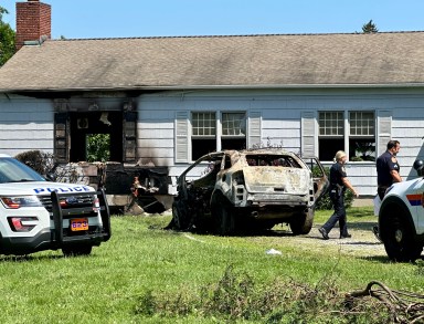 A driver died after crashing into the Manhasset Quaker meeting house. The car erupted into flames, which then spread to the building.