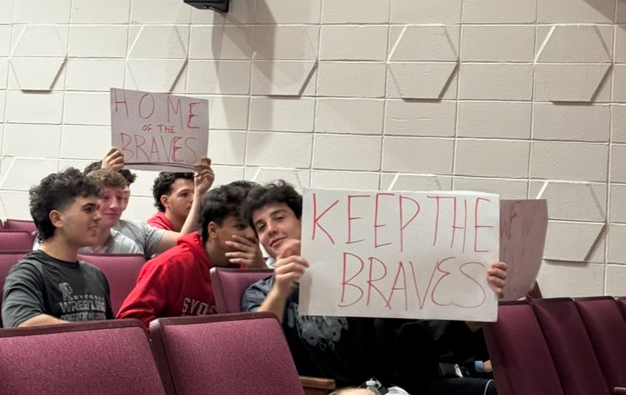 Syosset students brought signs reading "Keep the Braves" and "Home of the Braves" to the board of education meeting.