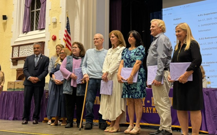 Oyster Bay Superintendent Francesco Ianni and Board President Laurie Kowalsky (Far L.) with seven of the district's retiring educators.