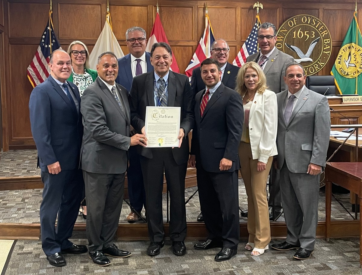 Jericho Superintendent Hank Grisham honored by the Town of Oyster Bay before he retires at the end of the school year.