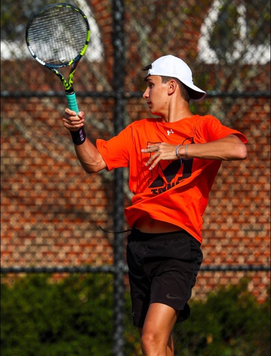 Max Golubenko mid tennis match