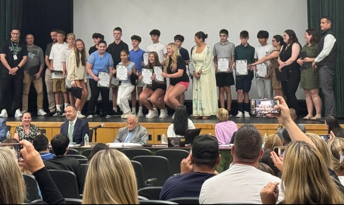 Middle school students accepting their awards