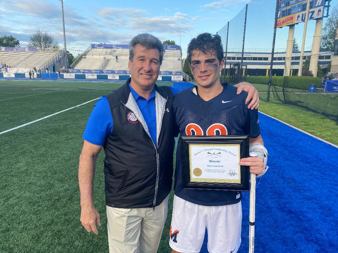Kyle Melkonian of Manhasset High School received the James C. Metzger Lacrosse Leadership Award from Long Island lacrosse star Vincent J. Sombrotto.