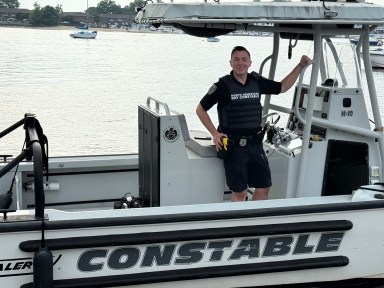 North Hempstead bay constable Aaron Tomlinson was the first on the scene of a boat fire in the Long Island Sound, personally rescuing three of the 23 people.