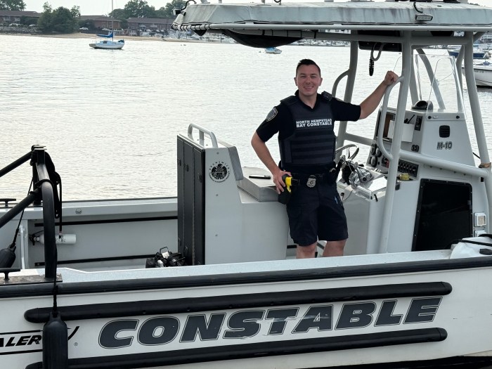 North Hempstead bay constable Aaron Tomlinson was the first on the scene of a boat fire in the Long Island Sound, personally rescuing three of the 23 people.