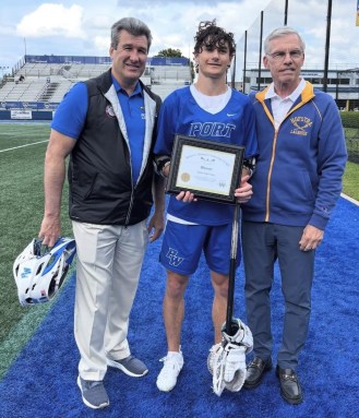 Schreiber High School lacrosse player honored with James C. Metzger Leadership Award.