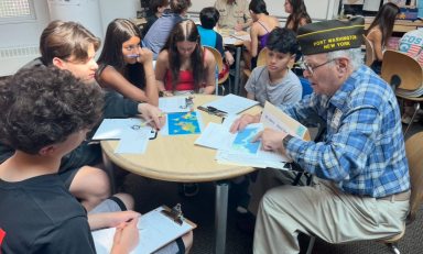 Weber Middle School students interviews veterans.