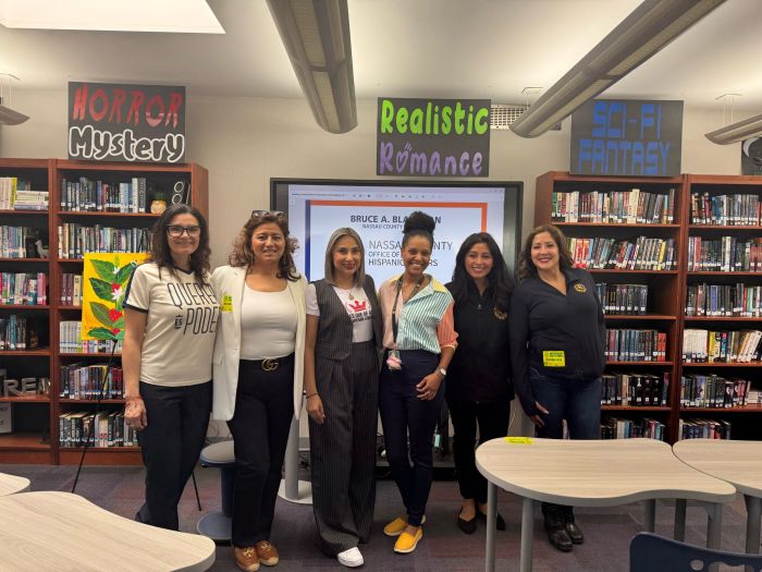 Westbury High School World Language Chairperson Shirley Vargas with authors Sasha Quintanilla, Elvia Sanchez, Adriana Devers, Estefany Ruiz and Melissa Figueroa from Nassau County office of Hispanic Affairs.