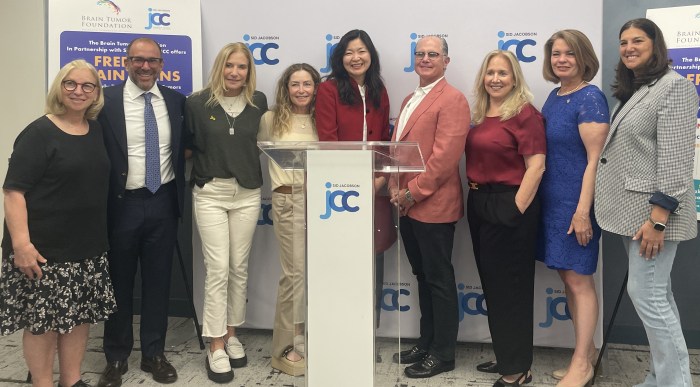 Officials gathered at the Sid Jacobson JCC for the announcement of the partnership.