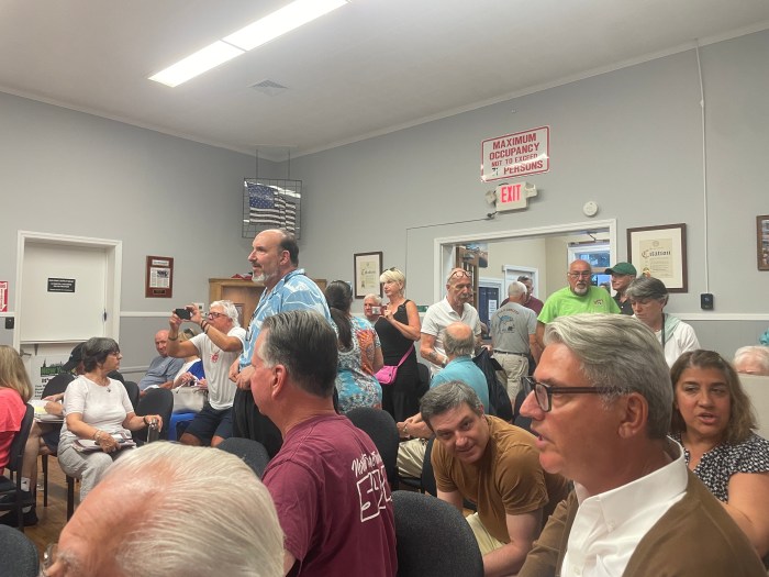 Residents stormed out after the board approved the site plans in a 4-0 vote.