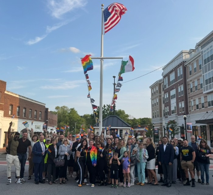 Over 50 gather to celebrate the raising of the Pride flag on Bridge Street.