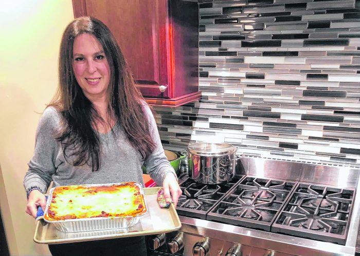 Melina Hale is among the Lasagna Love volunteers who make and deliver homemade lasagna to people struggling on Long Island and in NYC.