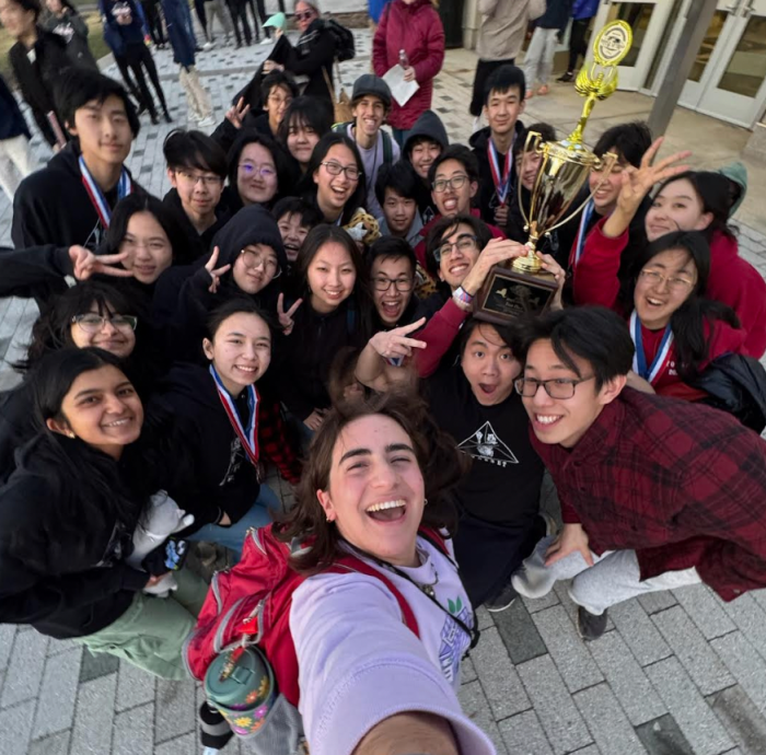 The Syosset Science Olympiad team celebrates its state victory with a selfie.