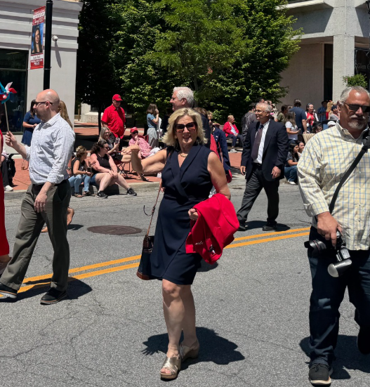 Mayor Pam Panzenbeck walks in the city's Memorial Day parade