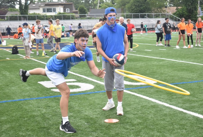 Birch Lane graduates competed in one of the relay races that culminated with throwing a hula hoop over a cone.