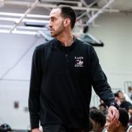 John Buck has been Long Island Lutheran High School's basketball coach for over 15 years, leading the program to several championships.