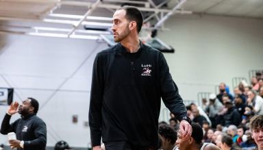 John Buck has been Long Island Lutheran High School's basketball coach for over 15 years, leading the program to several championships.