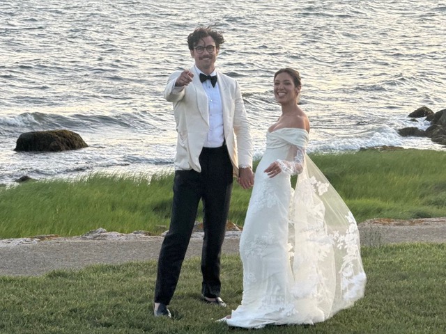 Jason Grohowski (L.) and Simone Cruikshank Rivera Grohowski (R.) celebrate their wedding on July 19.