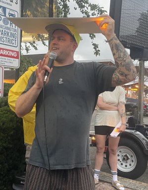 Evan Freed, a member of the Port Washington Democratic Club, spoke about a woman who feared ICE was outside her door Monday morning.