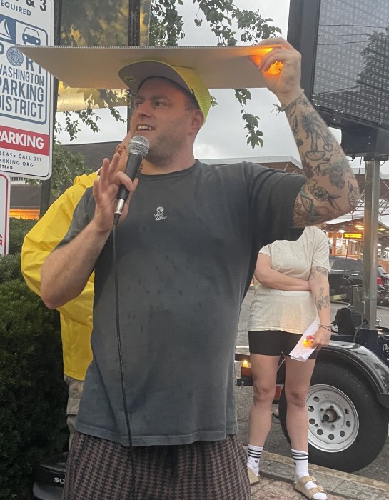 Evan Freed, a member of the Port Washington Democratic Club, spoke about a woman who feared ICE was outside her door Monday morning.