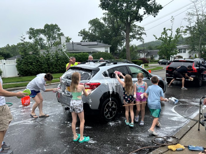 The Port Washington community joined together to host a car wash in honor of 9-year-old Logan Coyle, who was diagnosed with liver cancer.