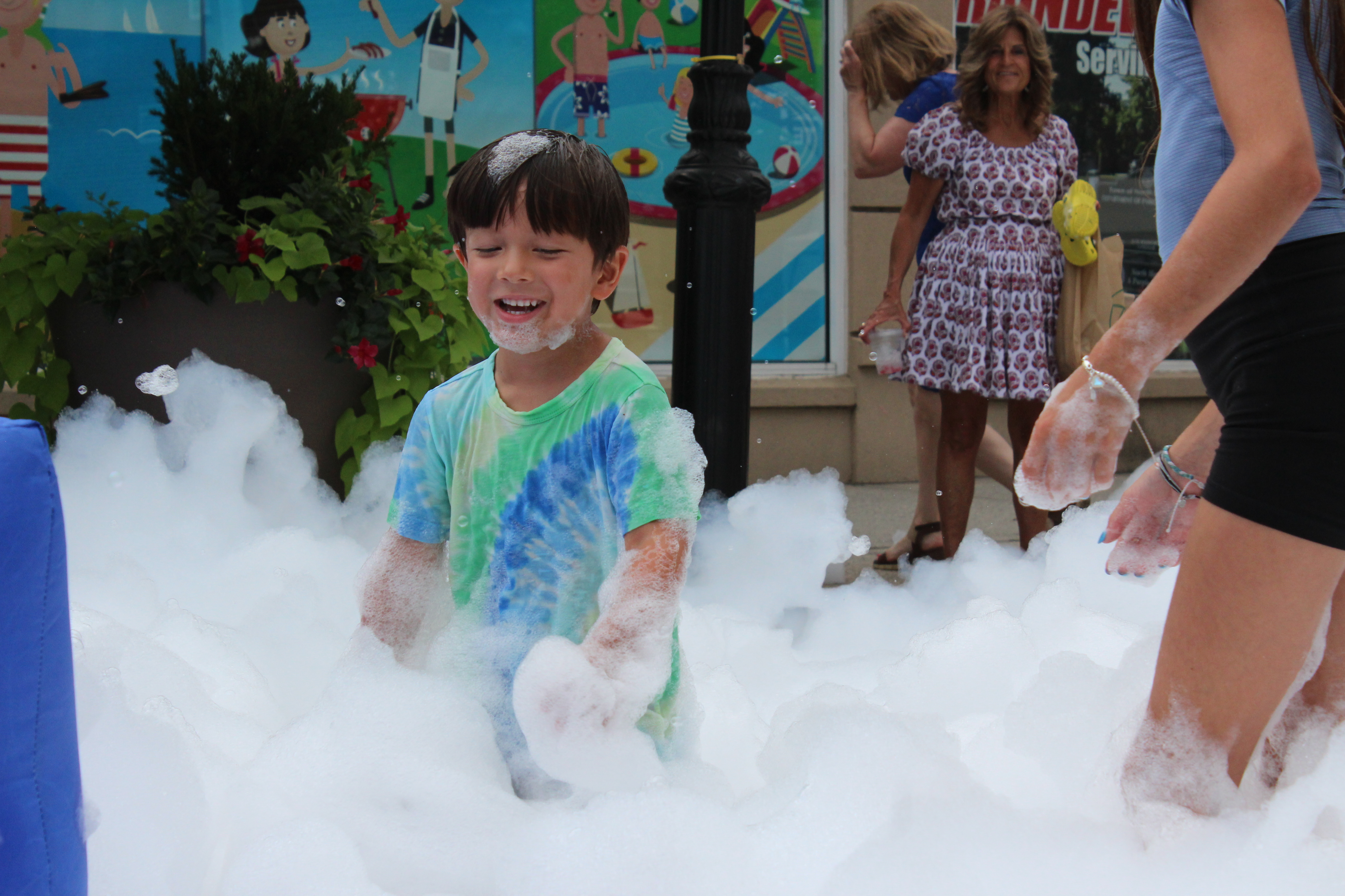 A child plays in the foam pit.