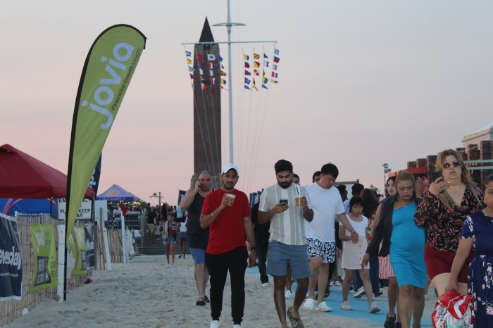 Families headed to the sand to get ready for the fireworks.