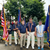 Members of the Syosset VFW Post 6394 stand in Memorial Park after this year's Memorial Day parade.