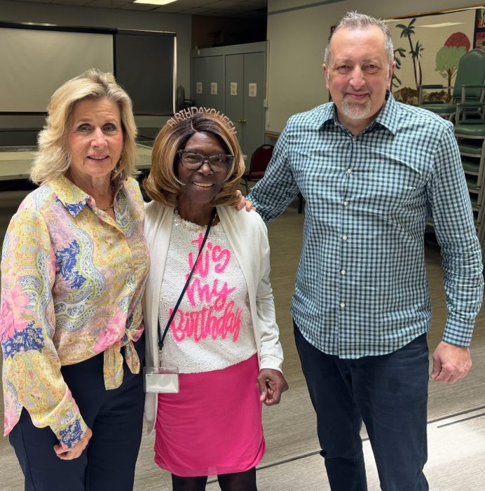 Mayor Pam Panzenbeck, Rotary Club President Toya Davis and David Geliashvili.