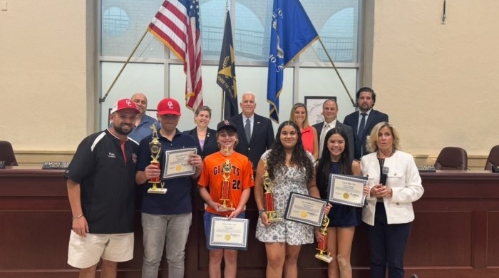 Joseph Portaro, Tate Bennet, Mia Berrios and Kathleen Anello (Center L. to R.) are honored by the Glen Cove City Council for their dedication to Little League.