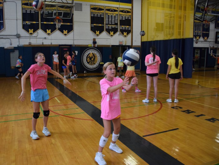 Girls volleyball players worked on basic skills before playing practice games. 