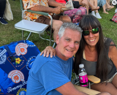 Concertgoers at the Morgan Park Summer Music Festival kickoff concert bring chairs and blankets to enjoy the show.