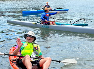 Kayakers finish the Paddle for Port race, which fundraises for nonprofit grants distributed by the Port Washington Community Chest.