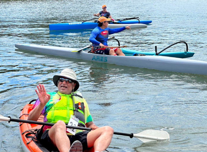 Kayakers finish the Paddle for Port race, which fundraises for nonprofit grants distributed by the Port Washington Community Chest.